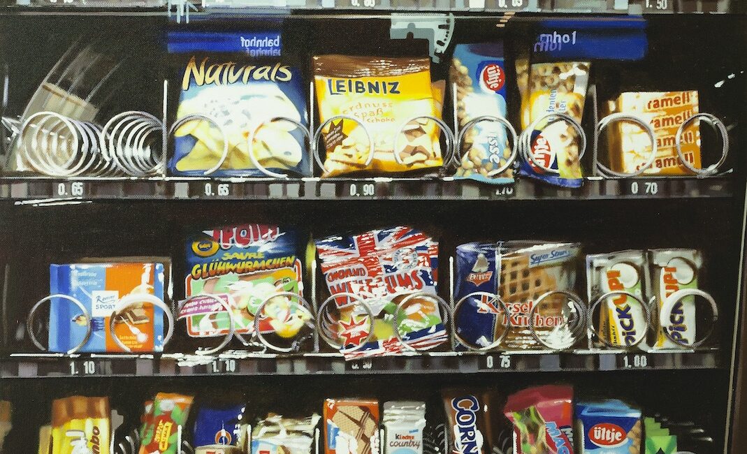 A vending machine with many colored products ready to be selected