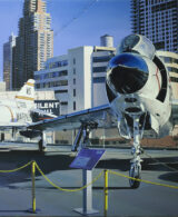 An Intrepid airplane parked on the roof of a skyscraper