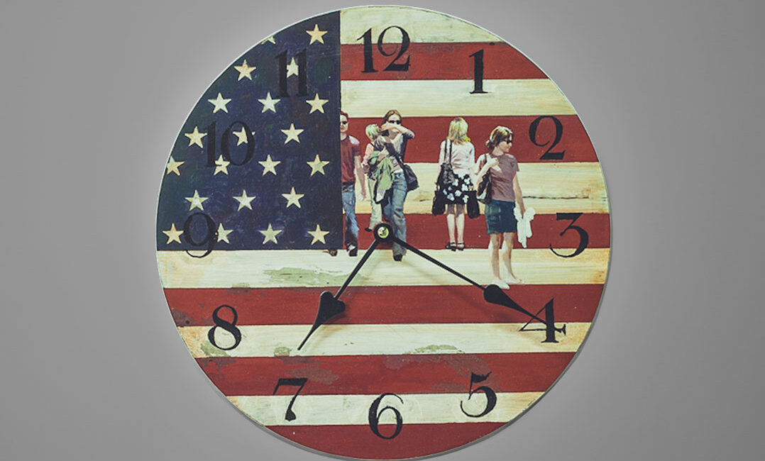 A wooden clock painted in acrylic representing some people walking with an American Flag in the background
