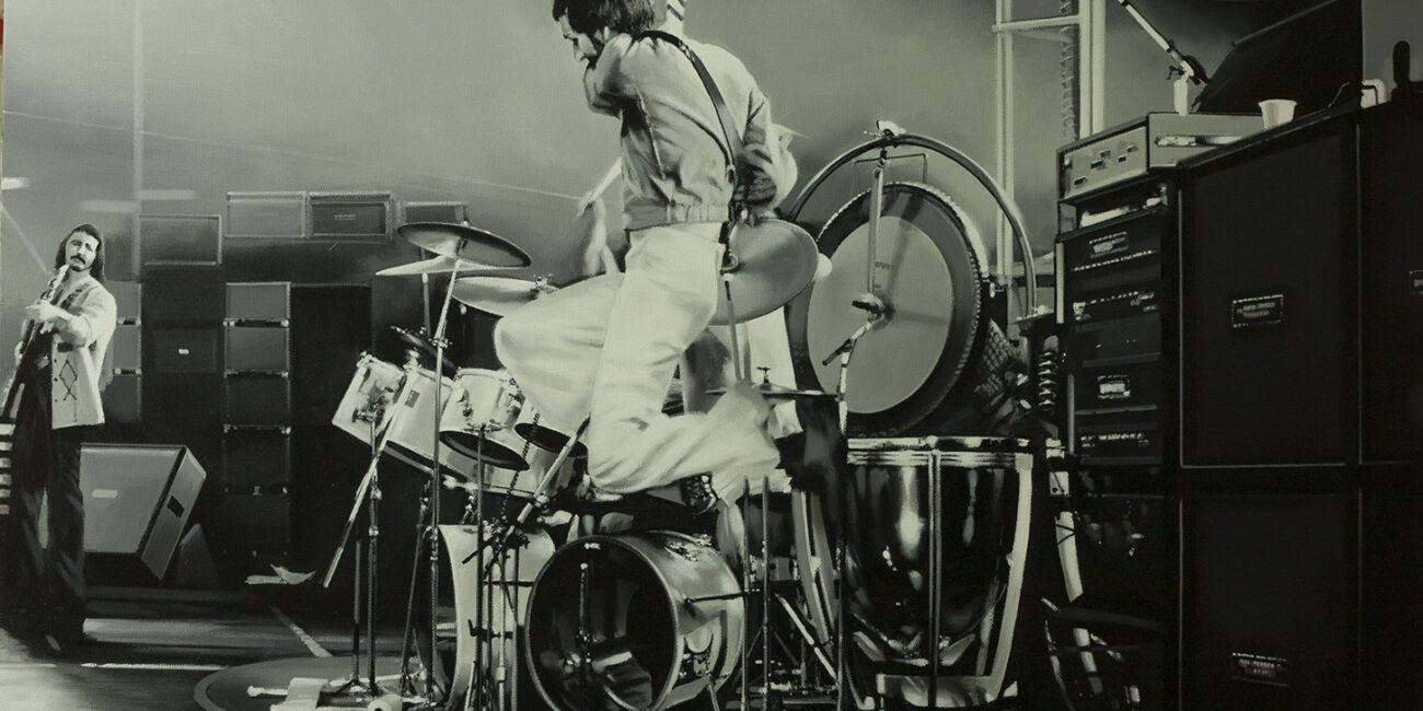 A portrait of The Who performing at a concert