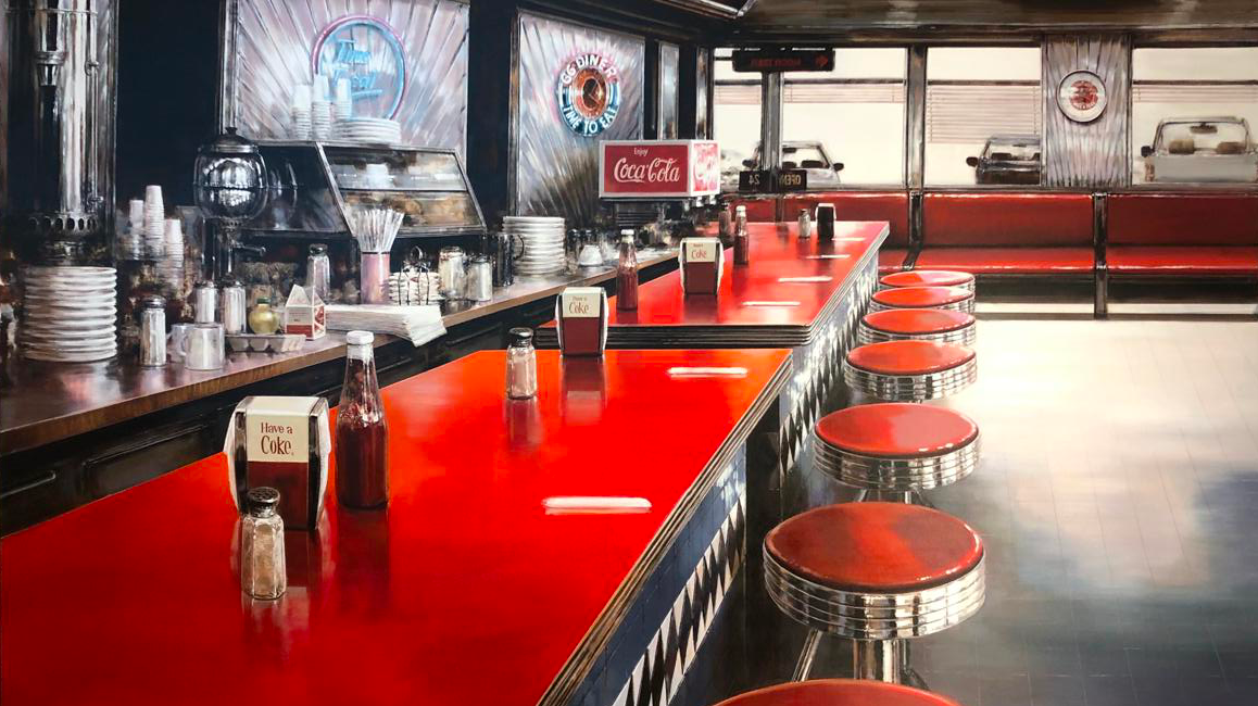 A red diner counter with shining red stools seen in perspective