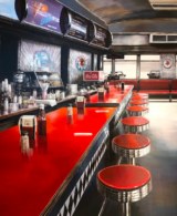 A red diner counter with shining red stools seen in perspective