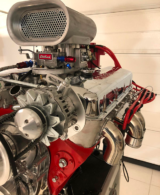 A big Edelbrock engine rebuilt by hand by Luigi Rocca with iron and aluminium seen from the side