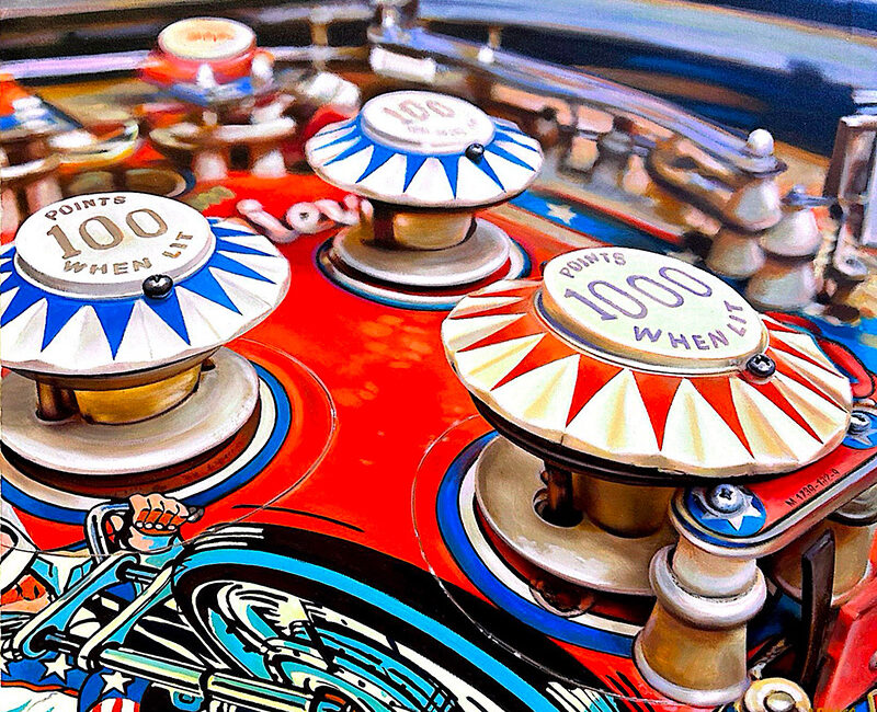 Detail of a pinball of Evel Knievel collection with three bumpers