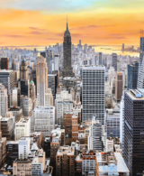An aerial view of New York with an orange sky